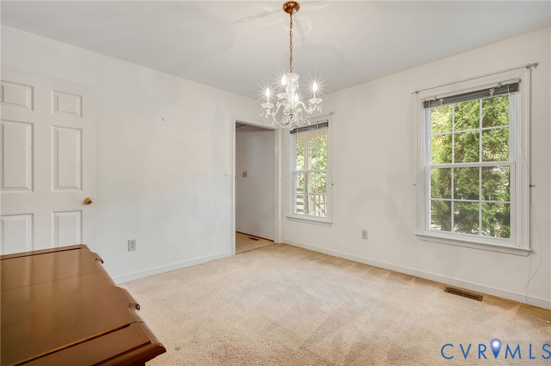3005 Wiltonshire Drive, Richmond, VA 23233 Dual windows with white trim, a decorative chandelier, and light-colored carpeting