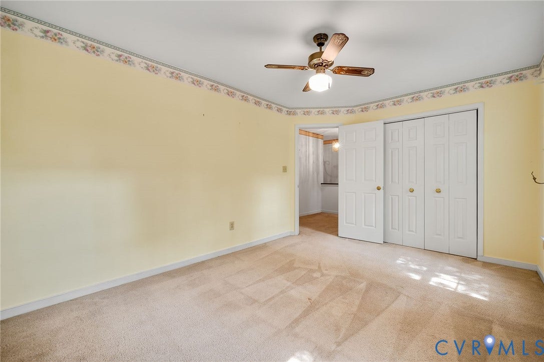 3005 Wiltonshire Drive, Richmond, VA 23233 Textured carpeting, ceiling-mounted fan with integrated lighting, bi-fold closet doors, and light-toned walls