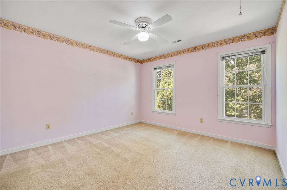 3005 Wiltonshire Drive, Richmond, VA 23233 Carpeted room with two windows, a ceiling fan, and decorative wallpaper border