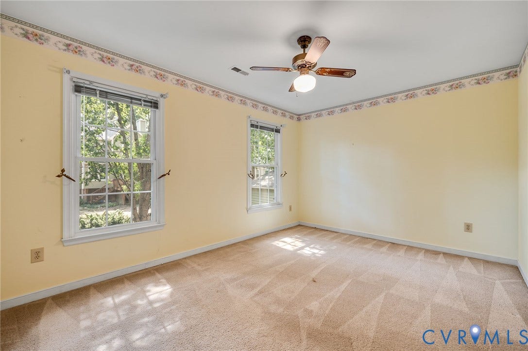 3005 Wiltonshire Drive, Richmond, VA 23233 Spacious room featuring a ceiling fan with integrated lighting, two double-hung windows, and wall-to-wall carpeting