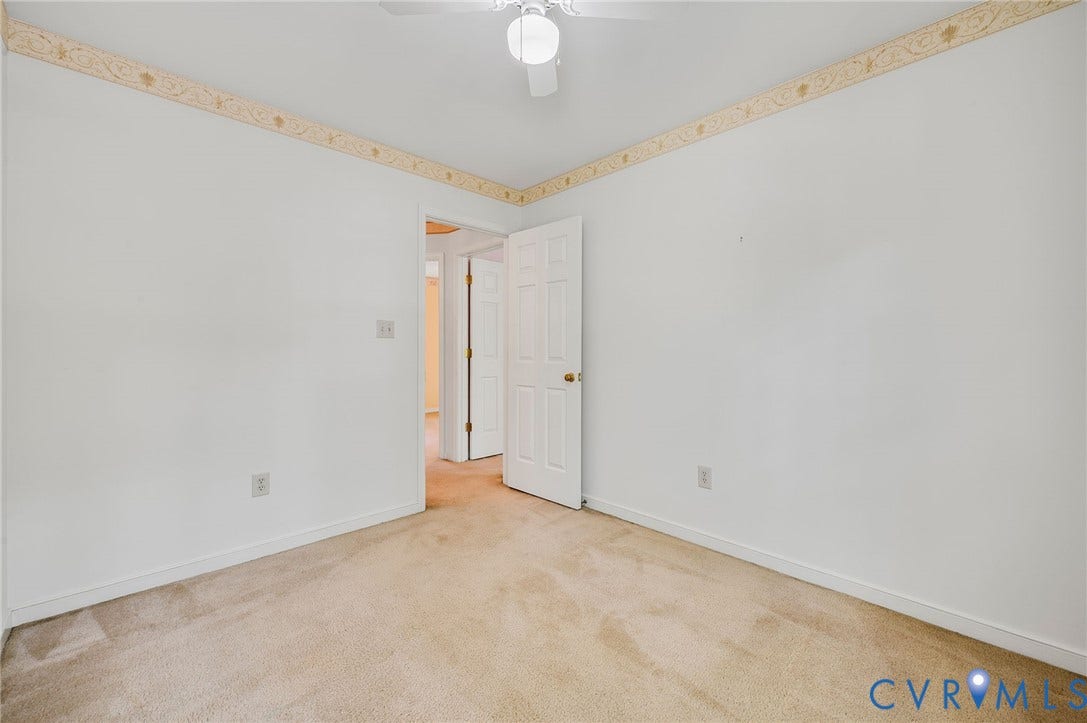 3005 Wiltonshire Drive, Richmond, VA 23233 Neutral carpet flooring, white walls, white ceiling, white ceiling fan, and white interior doors