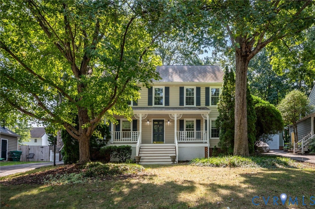 3005 Wiltonshire Drive, Richmond, VA 23233 Two-story residence with a covered front porch, white railings, and dark shutters