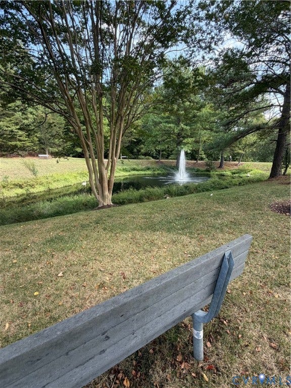 Enjoy the outdoor space on the park bench by the pond.