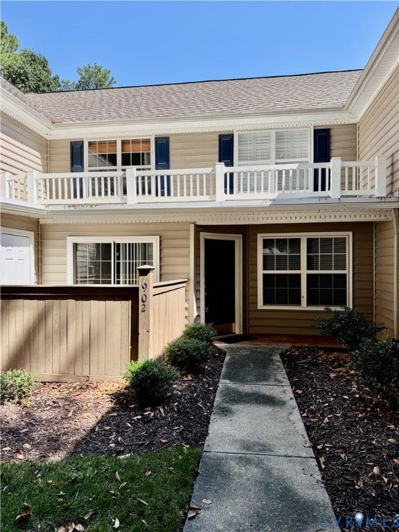 Two-story exterior with horizontal siding and a gabled roof