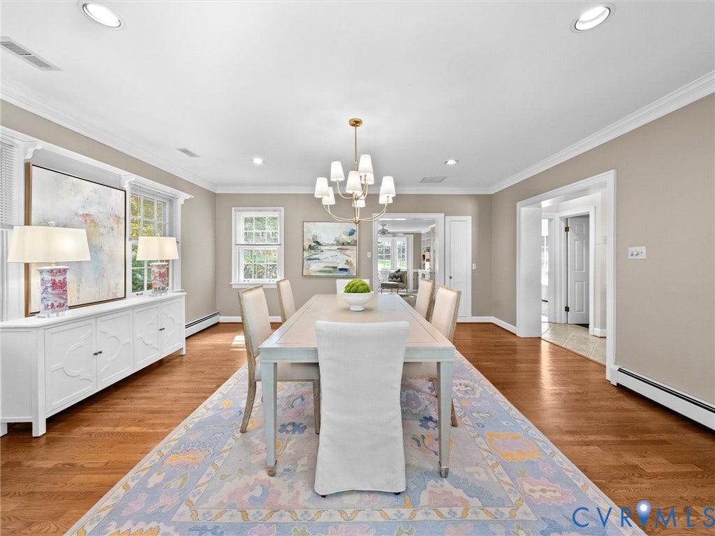 216 Ross Road, Westham Area, Henrico, VA 23229 Hardwood flooring, recessed lighting, crown molding, white built-in cabinetry, and a brass-finish chandelier