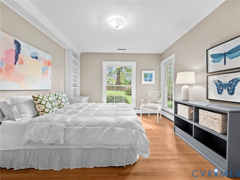 216 Ross Road, Westham Area, Henrico, VA 23229 Hardwood flooring, crown molding, built-in shelving, white window trim, and a flush mount ceiling light