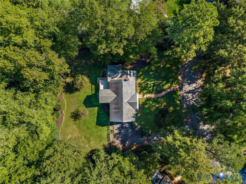 216 Ross Road, Westham Area, Henrico, VA 23229 Lush green landscaping with mature trees, expansive paved driveway, and traditional roofline