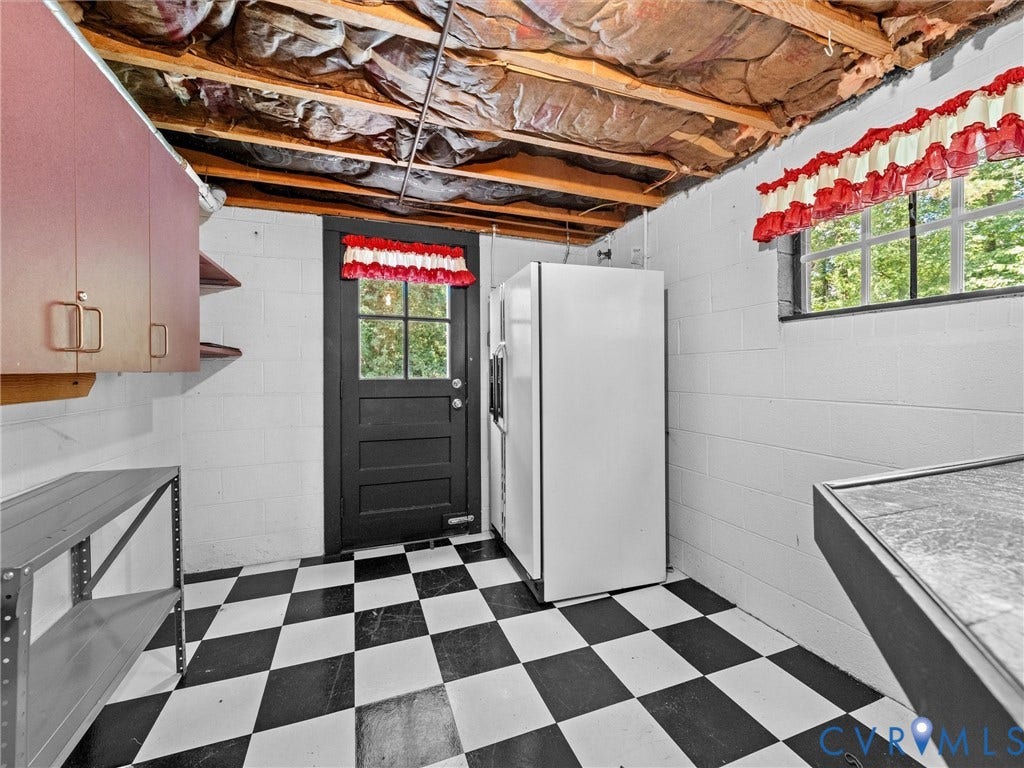 216 Ross Road, Westham Area, Henrico, VA 23229 Black and white checkered flooring, white block walls, exposed ceiling joists, and an exterior access door with window pane