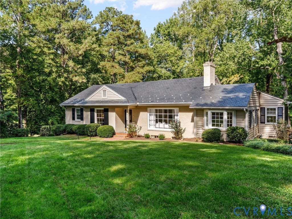 216 Ross Road, Westham Area, Henrico, VA 23229 Expansive front lawn, mature trees, stucco exterior, multi-pane windows, and a prominent chimney