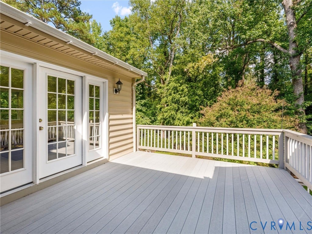 216 Ross Road, Westham Area, Henrico, VA 23229 Expansive outdoor deck with a light-toned surface and a white railing
