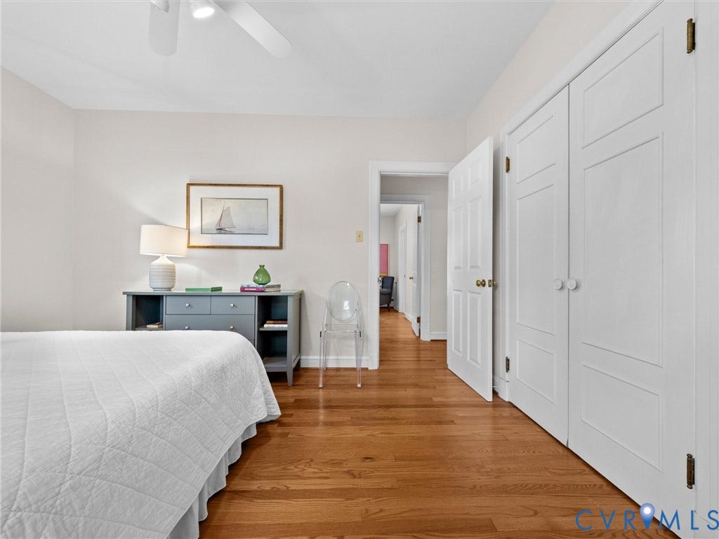 216 Ross Road, Westham Area, Henrico, VA 23229 Hardwood flooring, ceiling fan, white paneled doors, and light-colored walls