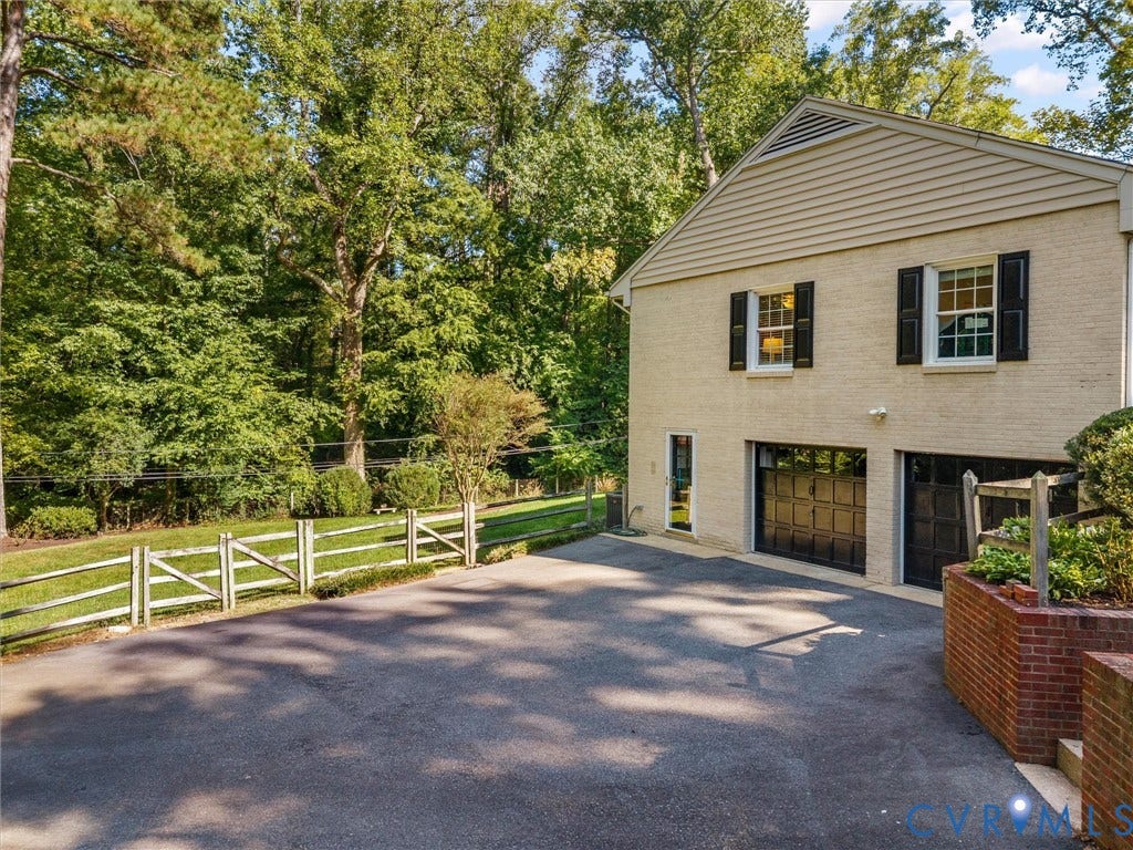 216 Ross Road, Westham Area, Henrico, VA 23229 Brick exterior with black shutters and a two-car garage