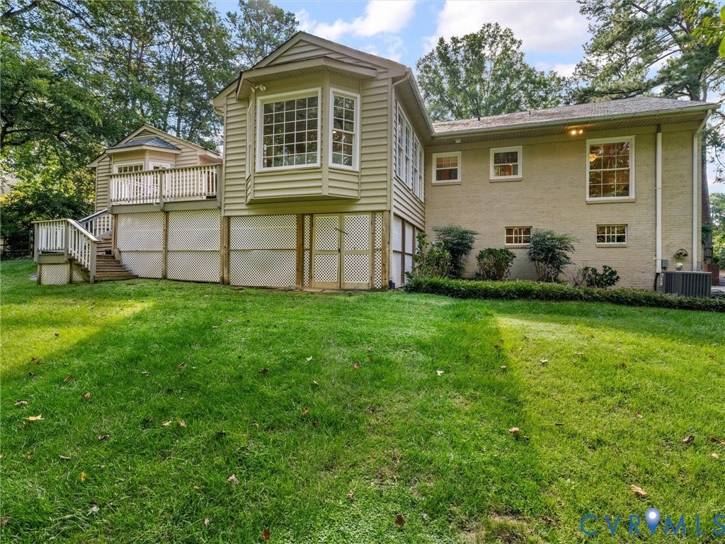 216 Ross Road, Westham Area, Henrico, VA 23229 Expansive rear lawn, multi-level deck, bay window, exterior siding, and brick facade