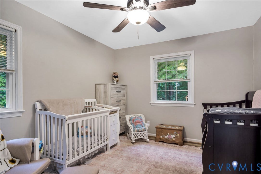 Neutral wall color, ceiling fan, and carpeted flooring