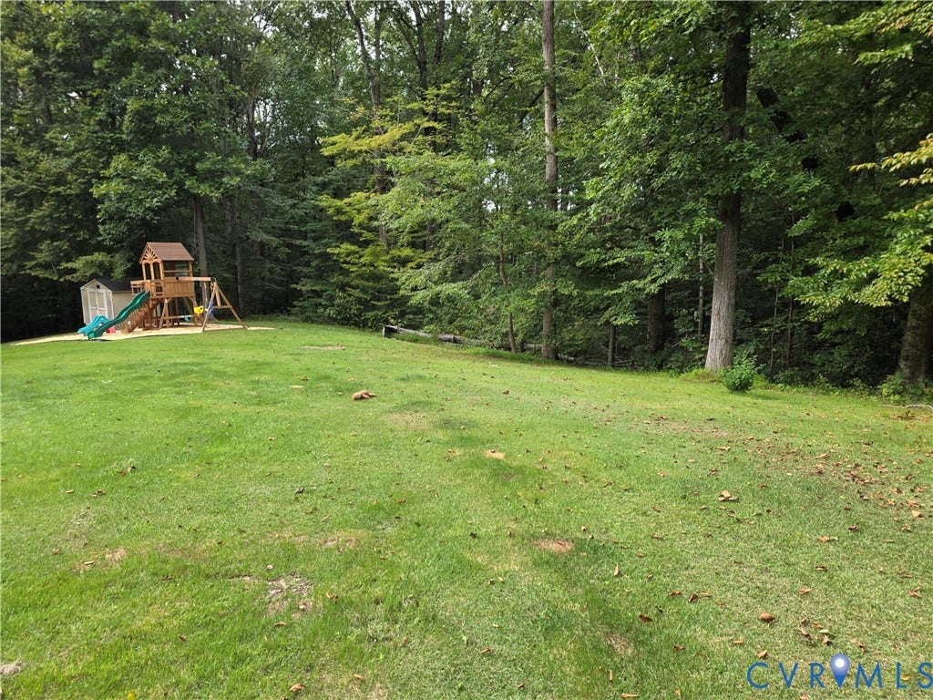 Expansive manicured lawn with mature perimeter trees