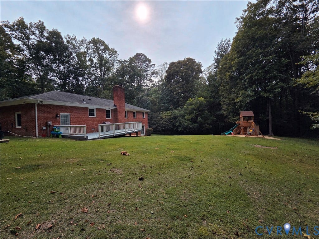 Expansive green yard with mature trees