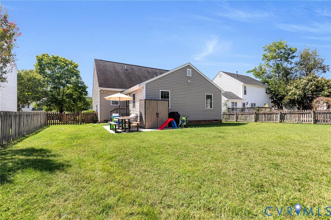 Expansive lawn space with a privacy fence
