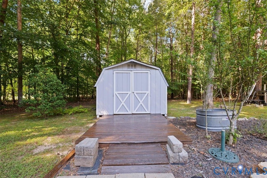 4398 Lynnecross Court, Powhatan, VA 23139 Gable-roof storage shed with a wood-finish platform