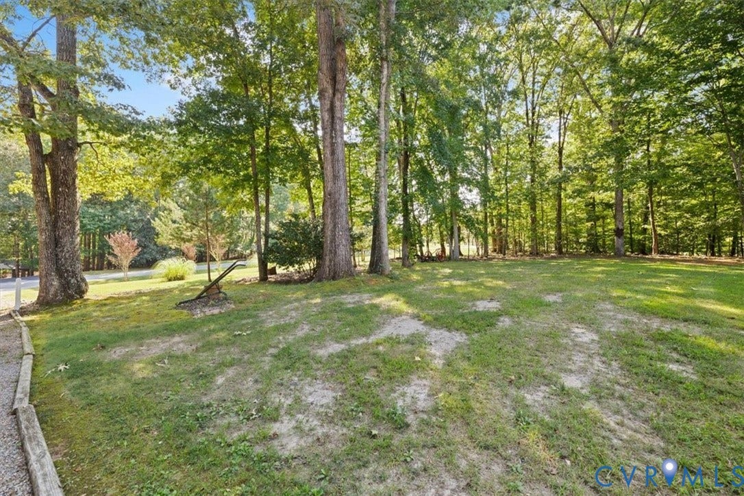4398 Lynnecross Court, Powhatan, VA 23139 Expansive grassy area surrounded by mature trees