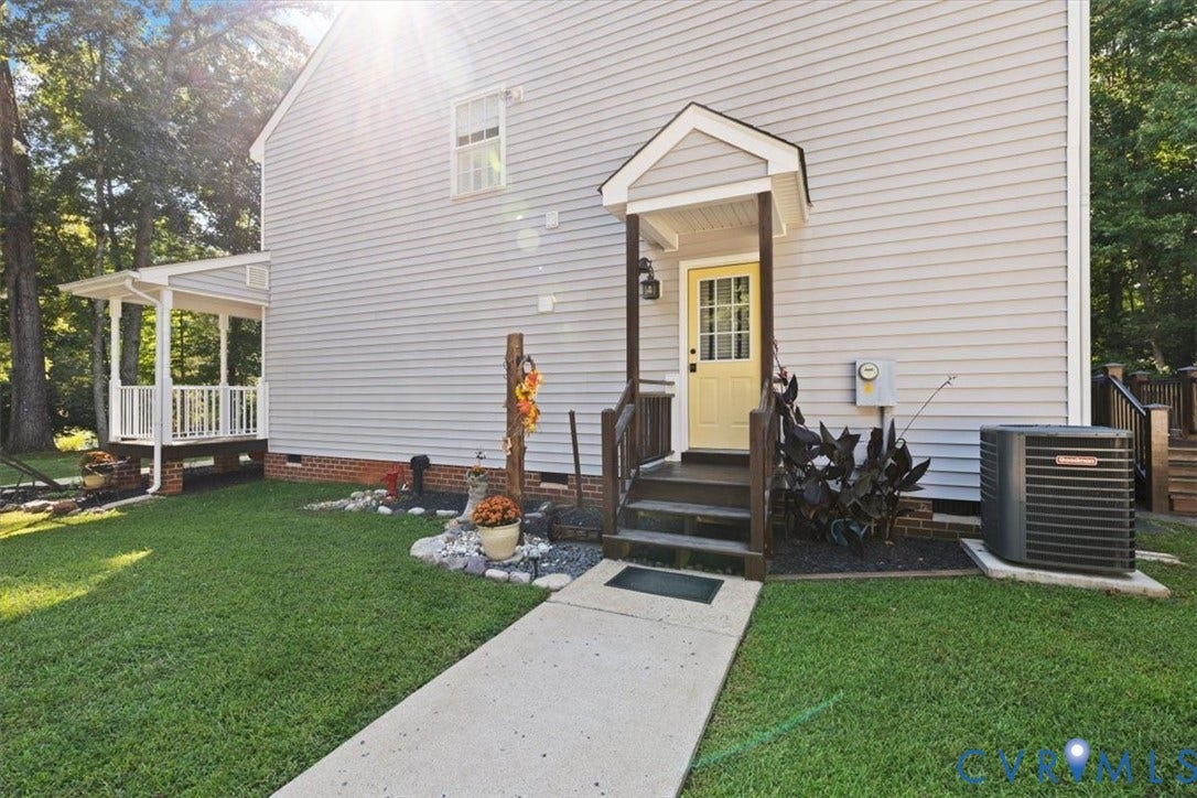 4398 Lynnecross Court, Powhatan, VA 23139 Light-colored siding exterior with a covered side entrance