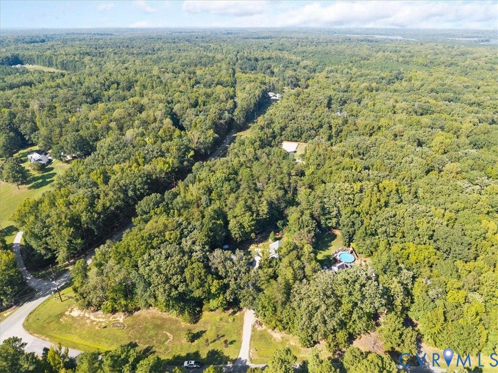 4398 Lynnecross Court, Powhatan, VA 23139 Expansive wooded property featuring a residence, detached structure, and an above-ground pool