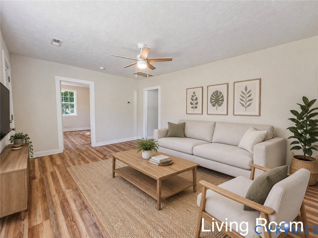 VIRTUALLY STAGED; Wood-finish flooring, light-toned walls, and a ceiling fan with integrated lighting