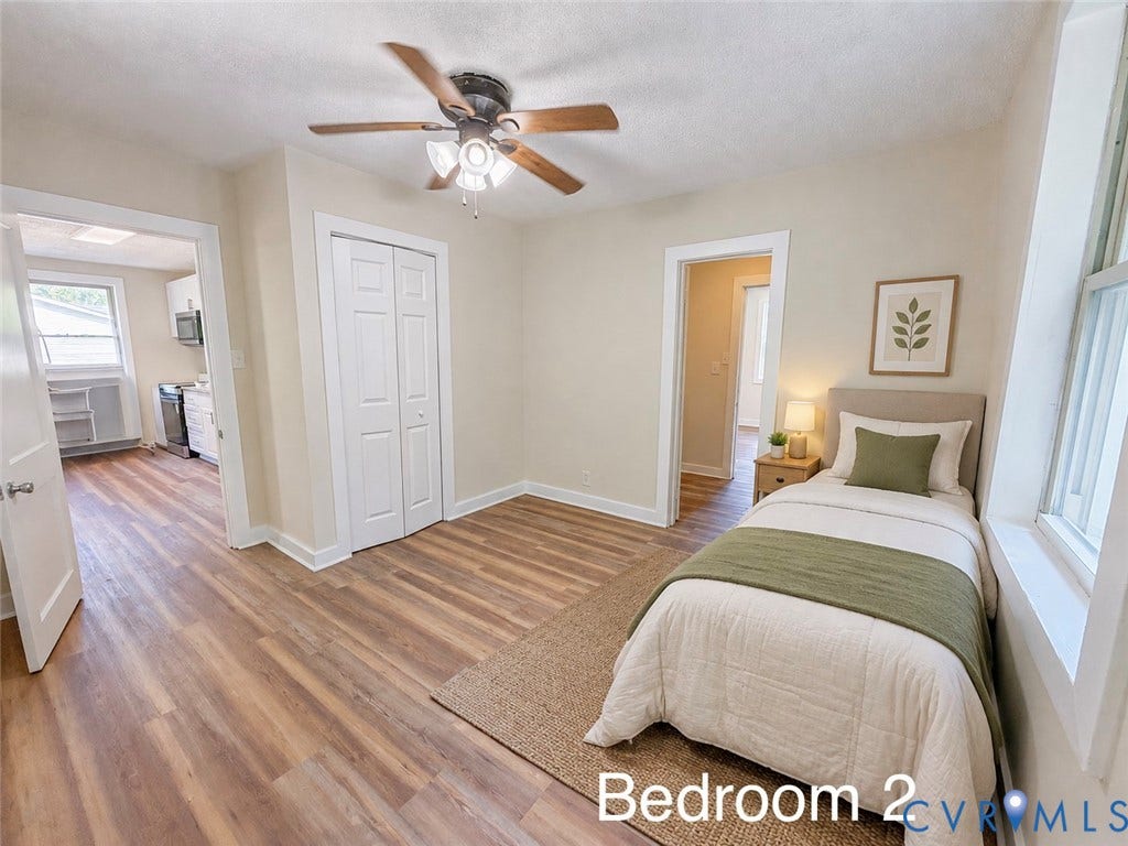 VIRTUALLY STAGED; Wood-finish flooring, bi-fold closet, ceiling fan with integrated lighting, and white trim