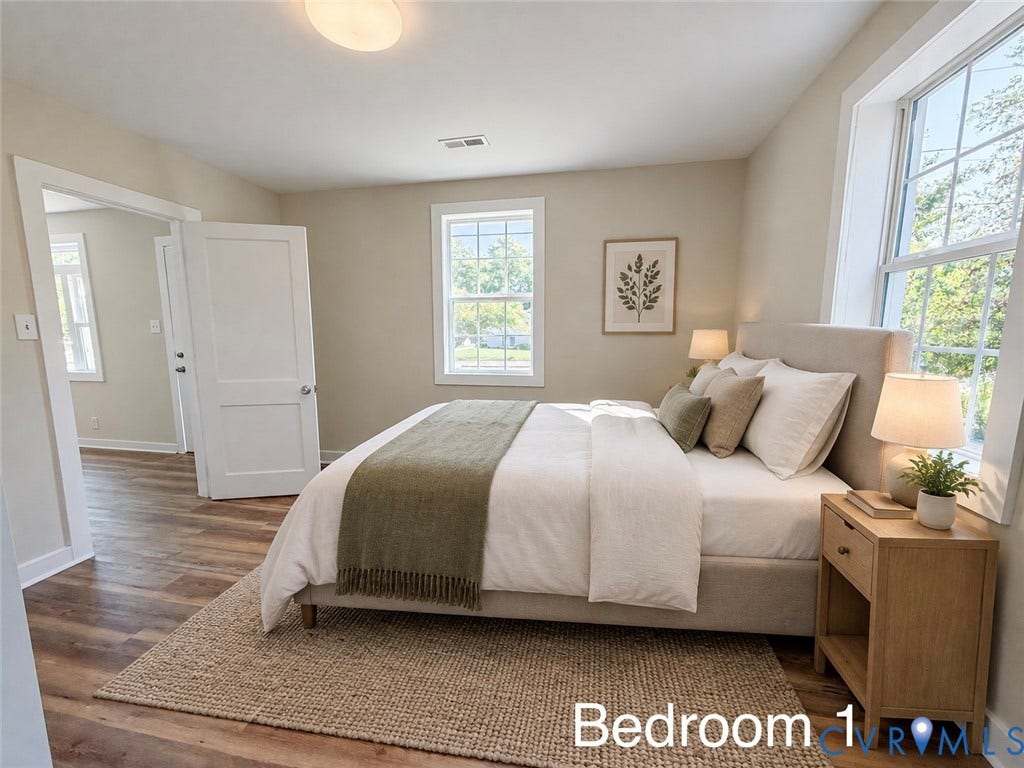 VIRTUALLY STAGED; Wood-finish flooring, two large windows, white trim, and a flush mount ceiling light
