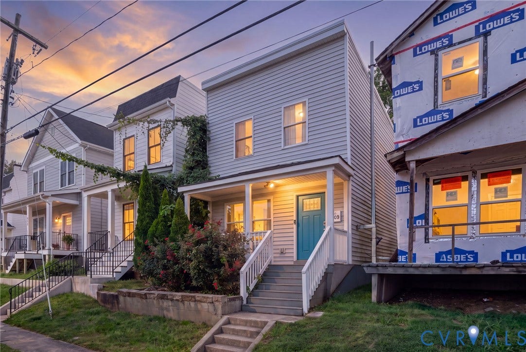 Two-story exterior with light-colored siding