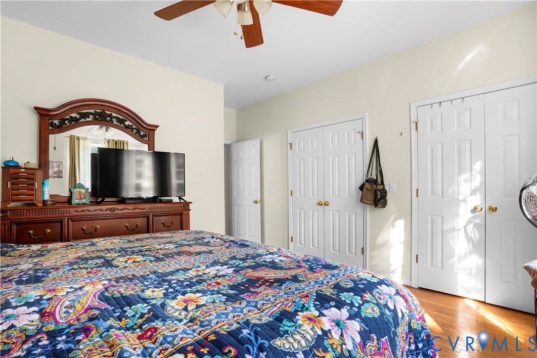 307 Poplar Dr, Louisa, VA 23093 Hardwood-style flooring, paddle fan, two panel doors, and neutral wall tones