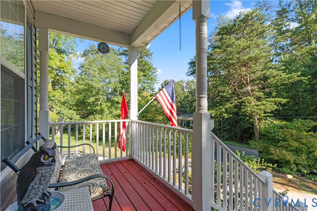 307 Poplar Dr, Louisa, VA 23093 Covered front porch featuring white railings, turned columns, and a red-stained floor