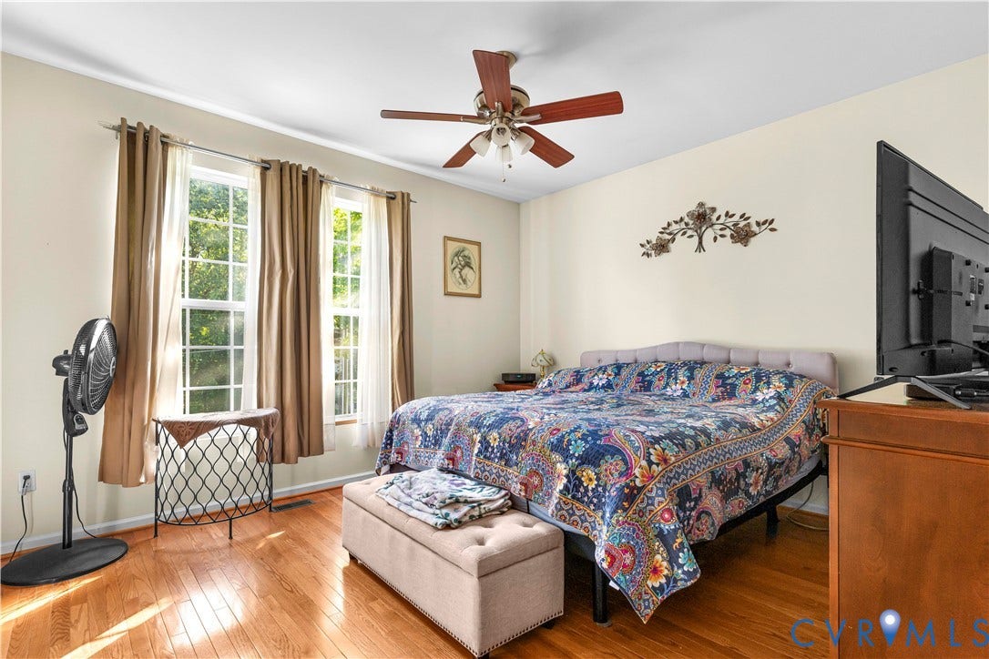 307 Poplar Dr, Louisa, VA 23093 Light wood-finish flooring, dual windows with ample natural light, a ceiling fan with integrated lighting, and a neutral wall color