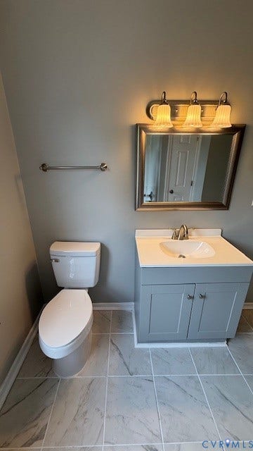 1424 Decatur Street, Rhodes Plan, Richmond, VA 23224 Bathroom featuring a gray vanity with a white countertop, chrome faucet, and rectangular mirror with a three-light fixture