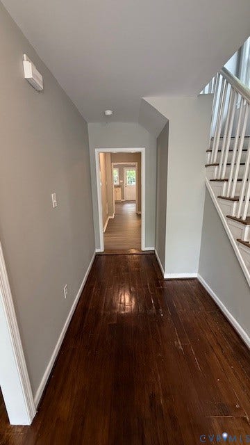 1424 Decatur Street, Rhodes Plan, Richmond, VA 23224 Hardwood flooring, painted walls, white trim, and a staircase with white balusters