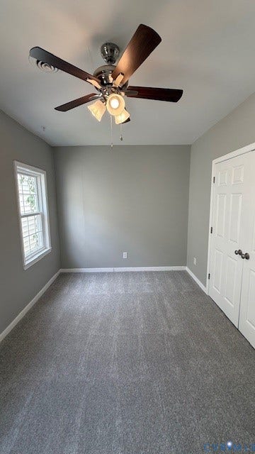 1424 Decatur Street, Rhodes Plan, Richmond, VA 23224 Neutral gray wall paint, gray carpet, white trim, and a white paneled door