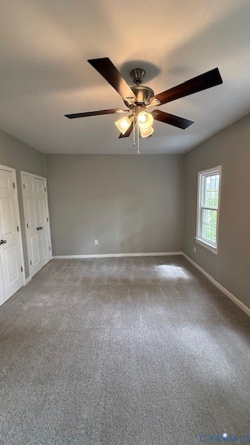 1424 Decatur Street, Rhodes Plan, Richmond, VA 23224 Gray carpeting, light gray walls, a window with white trim, and a ceiling fan with integrated lighting