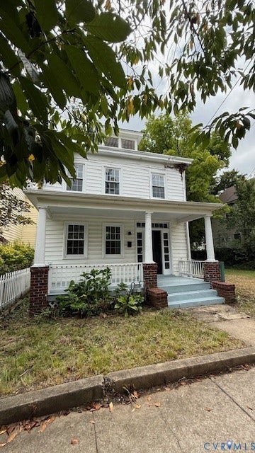 1424 Decatur Street, Rhodes Plan, Richmond, VA 23224 White siding exterior with a front porch, brick pillars, and a dormer window