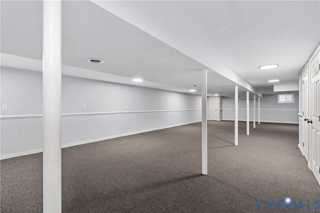 5221 Ecoff Avenue, Chester, VA 23831 Expansive finished lower level featuring recessed lighting, carpeting, white paneled walls, and white support columns