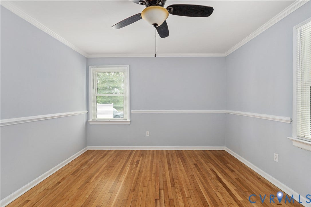 5221 Ecoff Avenue, Chester, VA 23831 Hardwood flooring, crown molding, chair rail detailing, ceiling fan with integrated lighting, and window with blinds