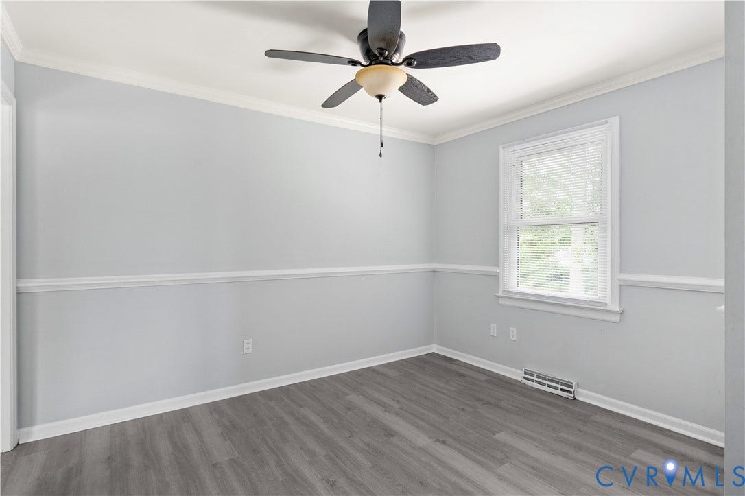 5221 Ecoff Avenue, Chester, VA 23831 Light gray wall paint with white crown molding and chair rail
