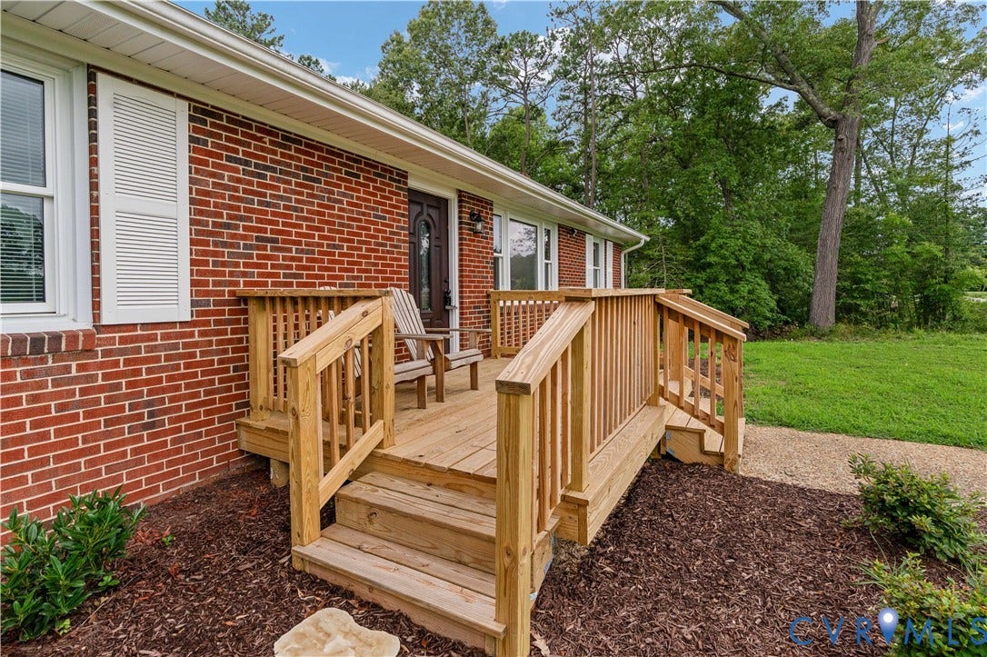 5221 Ecoff Avenue, Chester, VA 23831 Red brick exterior with white window shutters