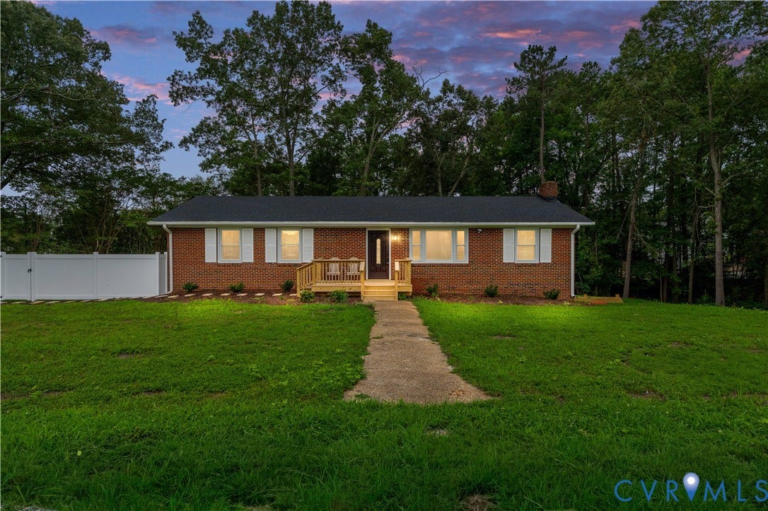 5221 Ecoff Avenue, Chester, VA 23831 Brick exterior with white shutters, a wood deck, and a dark shingle roof