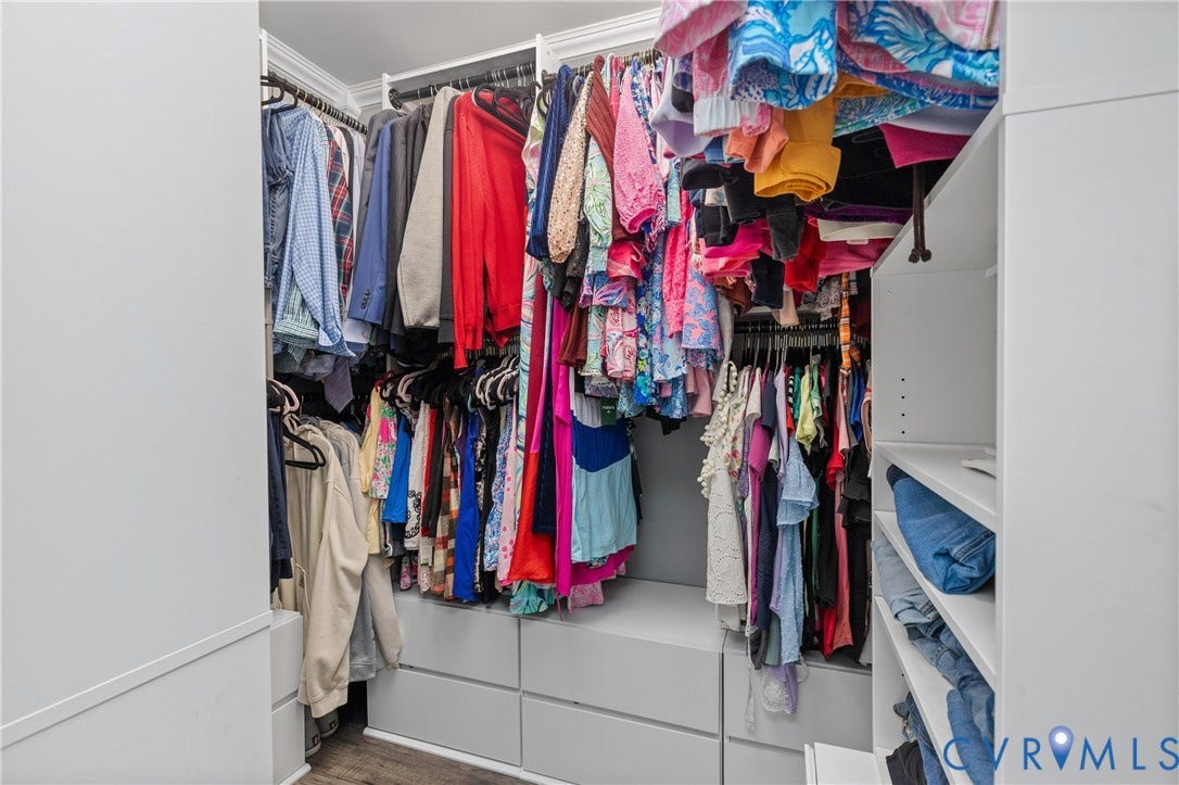 7625 Southford Lane, Chesterfield, VA 23832 Built-in closet organization system featuring multiple hanging rods, integrated shelving, and drawer storage