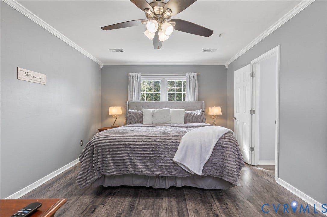 7625 Southford Lane, Chesterfield, VA 23832 Wood-finish flooring, ceiling fan with integrated lighting, window with white curtains, crown molding, and white trim