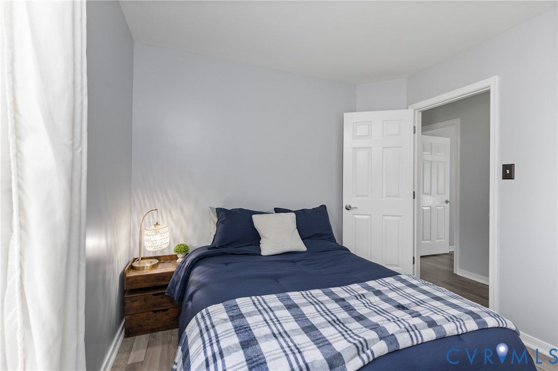 7625 Southford Lane, Chesterfield, VA 23832 Light gray wall paint, wood-finish flooring, white trim, and white paneled doors