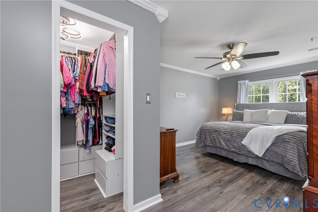 7625 Southford Lane, Chesterfield, VA 23832 Bedroom featuring wood-finish flooring, a ceiling fan with integrated lighting, and multiple windows