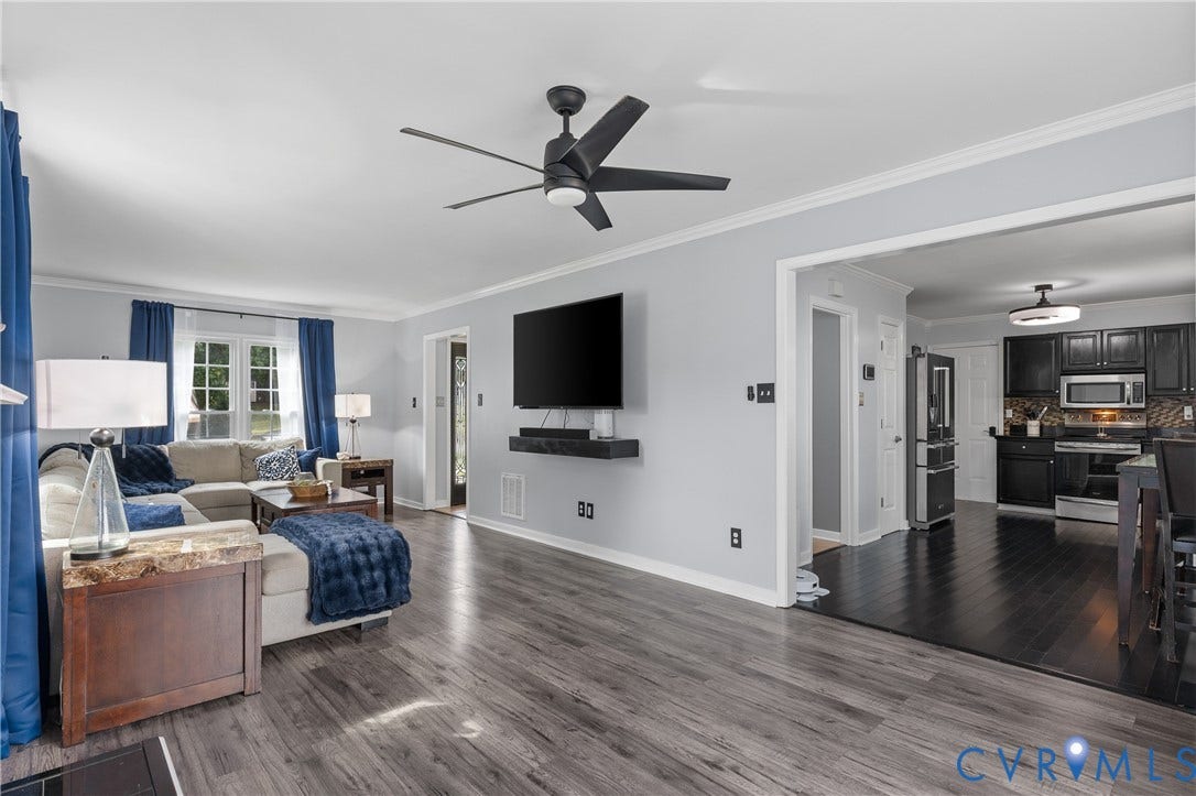 7625 Southford Lane, Chesterfield, VA 23832 Spacious living area featuring wood-finish flooring and a ceiling fan