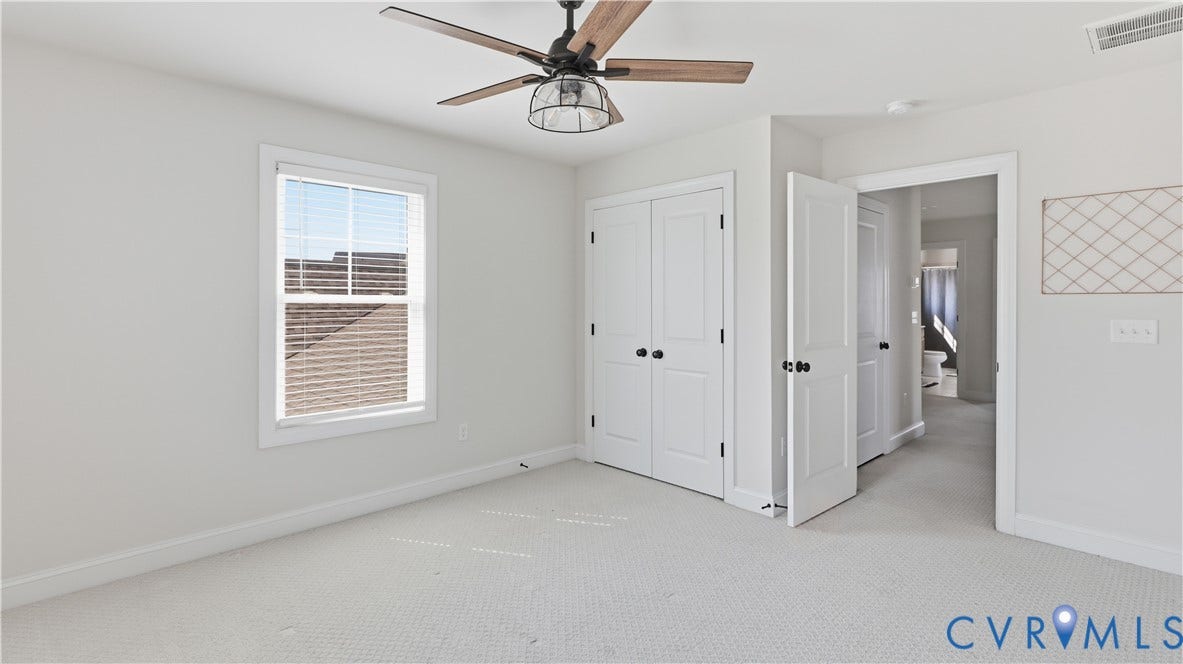 Recessed lighting, ceiling fan with light fixture, carpeted flooring, window with blinds, and white paneled doors