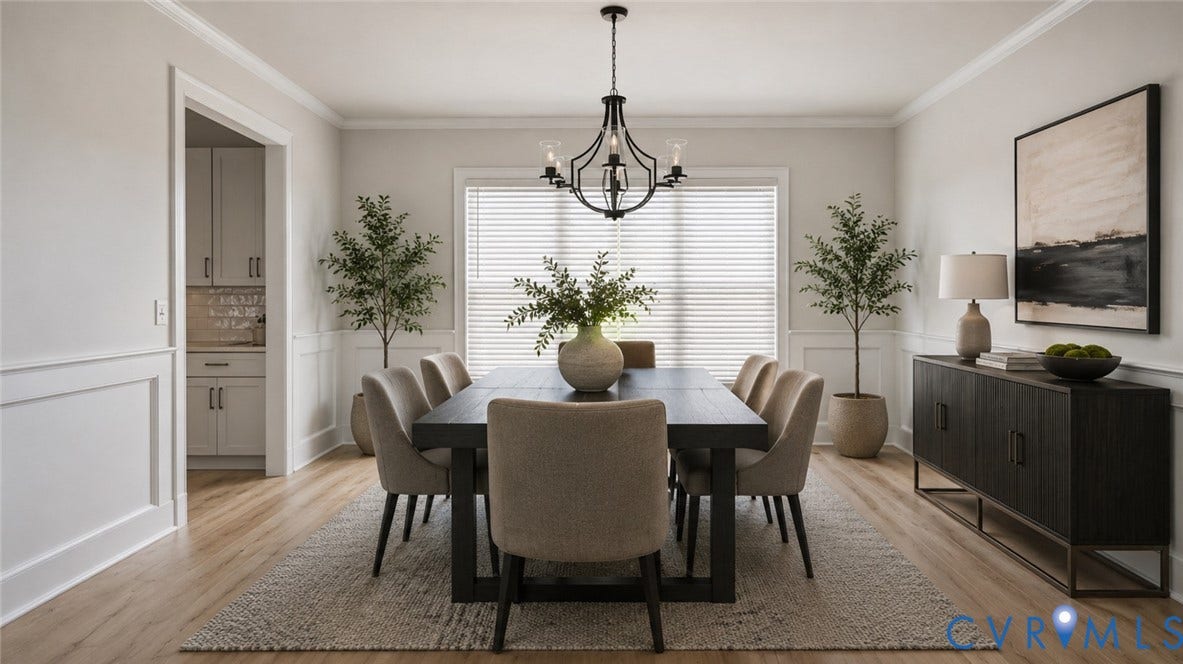 Spacious room featuring wood-finish flooring, wainscoting, and crown molding