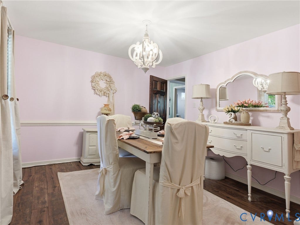 6723 Bull Hill Road, Prince George, VA 23875 Dining area featuring wood-finish flooring, chair rail molding, and a decorative chandelier